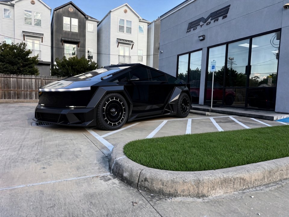 Custom blacked-out Tesla Cybertruck outside EVS Motors in Houston, TX