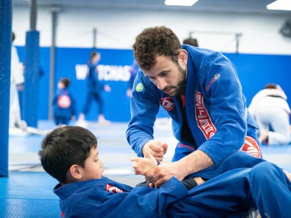 Kids Brazilian Jiu-Jitsu class on the mats at Gracie Barra Westchase in Houston