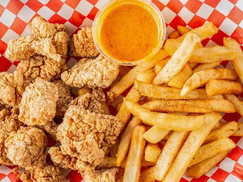 Crispy golden fried shrimp basket with seasoned fries at Mike's Seafood Houston